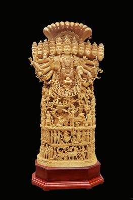 Visak Govind: 'viswaroopam', 2016 Woodworking Art, World Culture. This astonishing magical statue is 230cms 96 inchesin height, 140cms 55inchwide and has a diameter of 260cms. This statue is incarnated with one hundred and forty eight figures on it. The statue showcases the story of mahabharatha, mainly theVISHWAROOPAM . The statue is made from a single peice of wood wood ...